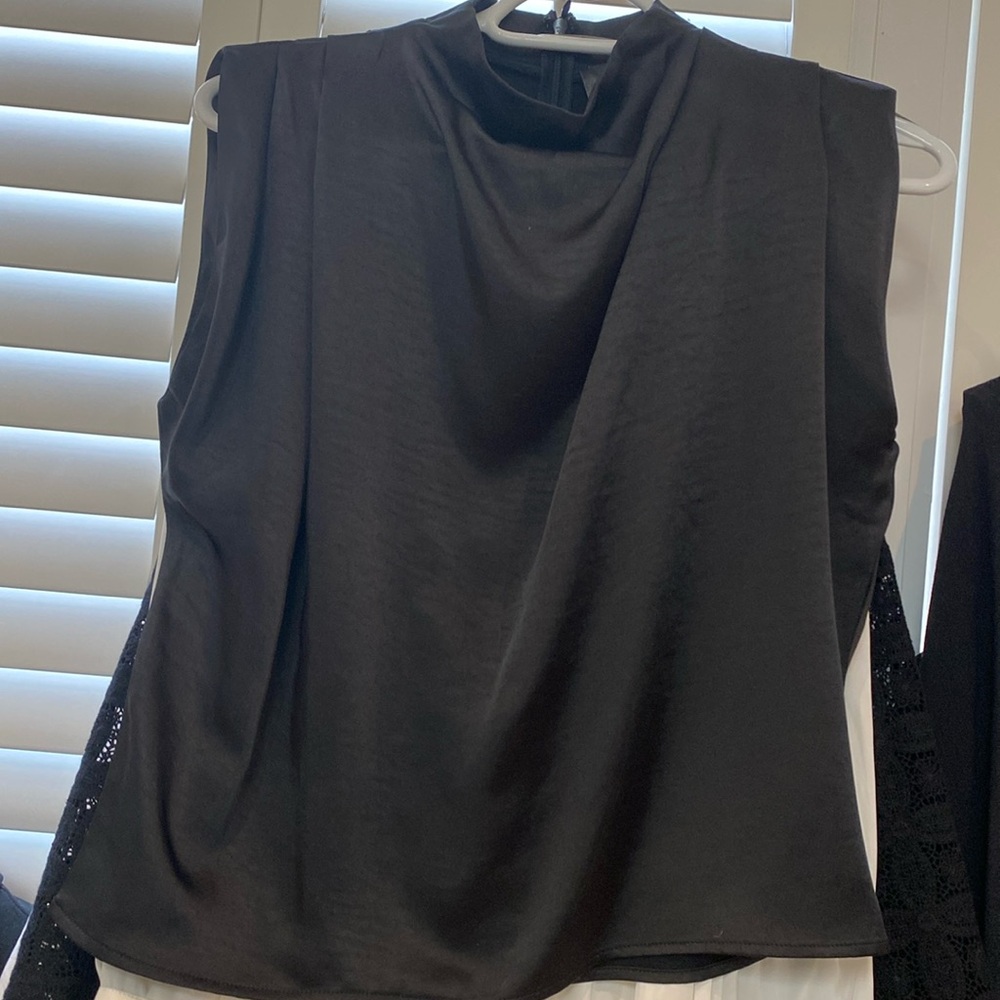 Black sleeveless high neck blouse